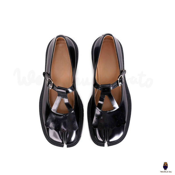 WoodchuckSato Tabi black split-toe mary janes with chunky cleated sole