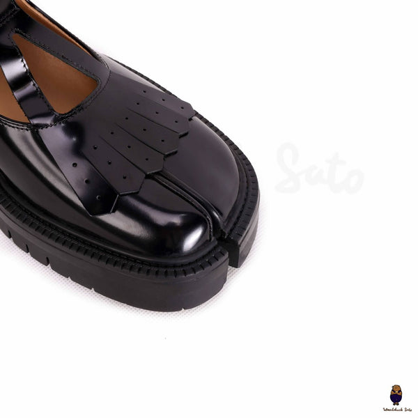 WoodchuckSato Tabi black split-toe mary janes with chunky cleated sole